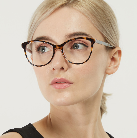 a lady wearing stylish cat eye glasses
