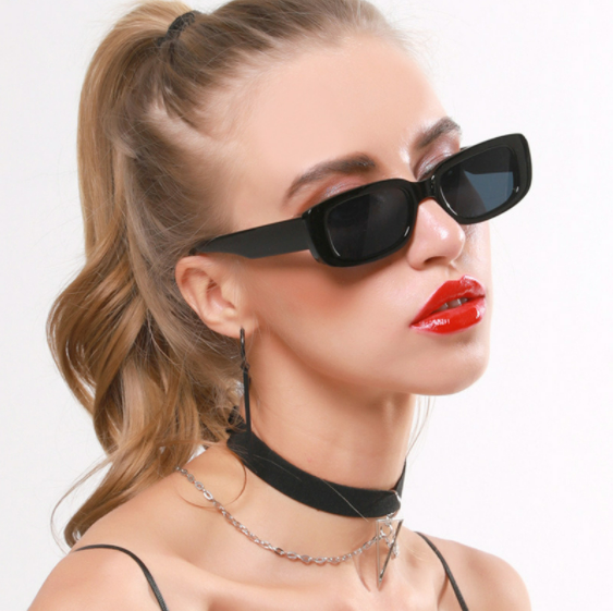 A young lady wearing rectangle sunglasses