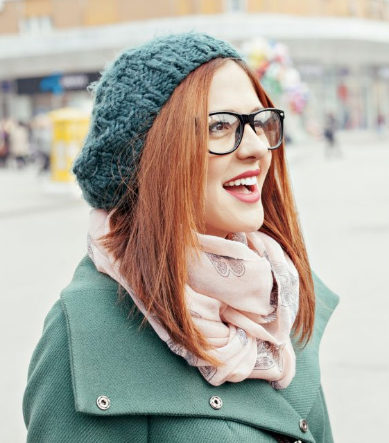 A woman wearing anti-glare glasses