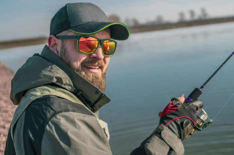an angler is fishing wearing polarized fishing sunglasses