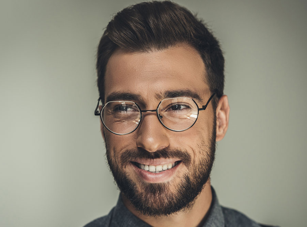 A man wearing half rim glasses