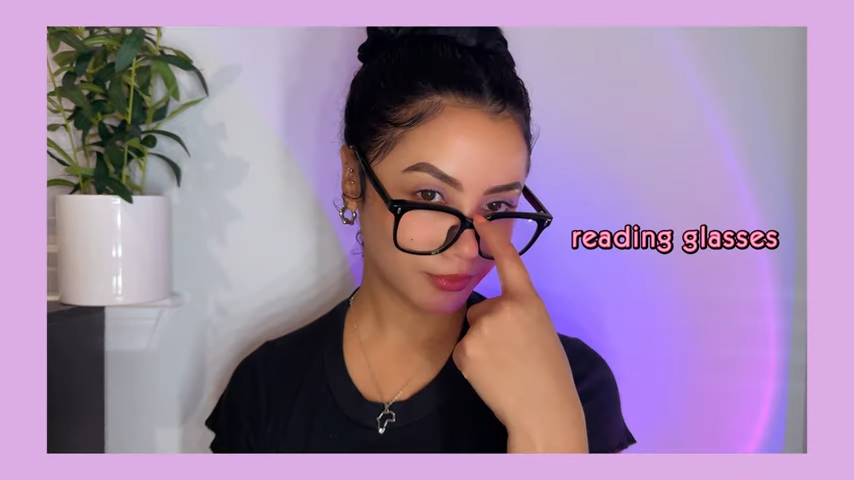 Kirsty Noskcaj wearing Sharon Sharon classic black - framed reading glasses, big - framed, simple yet striking, with "reading glasses" text shown.