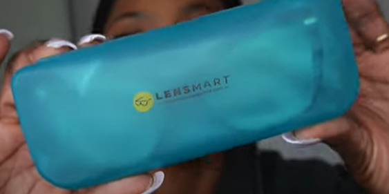 Tara Shanice displays the blue Lensmart glasses case, where each pair of glasses is individually packaged.