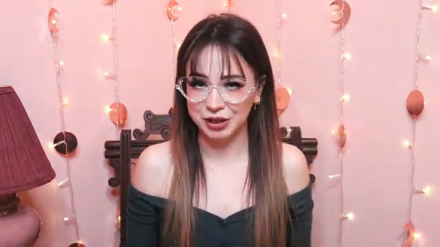 Zoe wearing Behati sparkling personality pair, featuring plastic semi-rimless frames with rhinestones embedded at the bottom, described as very lightweight and comfortable on the face.
