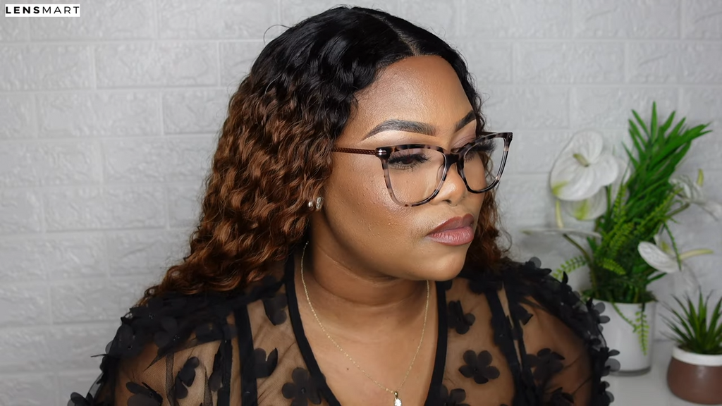 Mimi Manaso models the Anaya glasses by Lensmart, featuring a chic tortoise shell frame with detailed temples. She showcases their timeless and versatile style, which complements her hair and elegant black top.