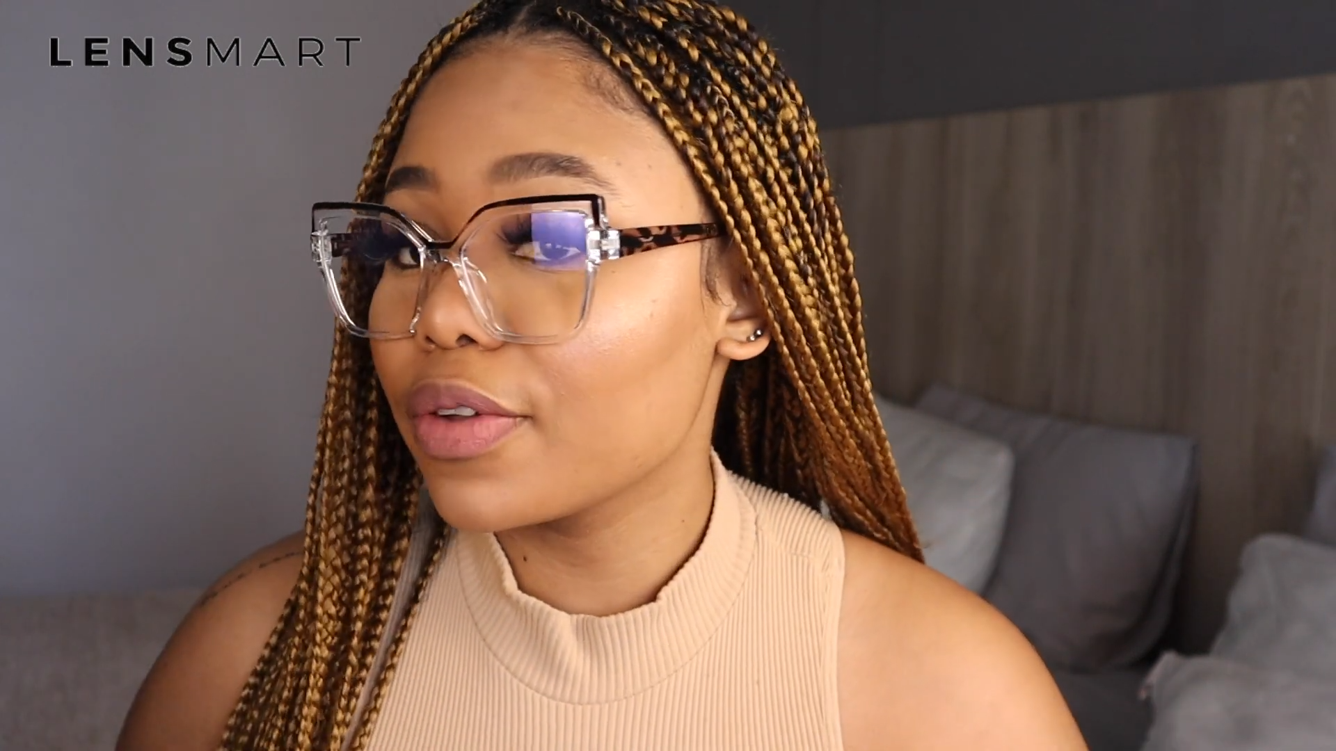 Salome Laka wearing Lensmart Marly glasses, featuring bold side detailing and a unique gold - blue - pink color palette for luxurious evening looks.