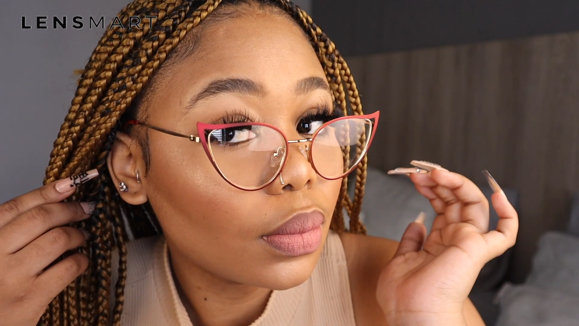 Salome Laka wearing Lensmart Caoimhe cat - eye glasses, featuring glitter accents, intricate detailing, and a modern transparent frame for understated luxury.