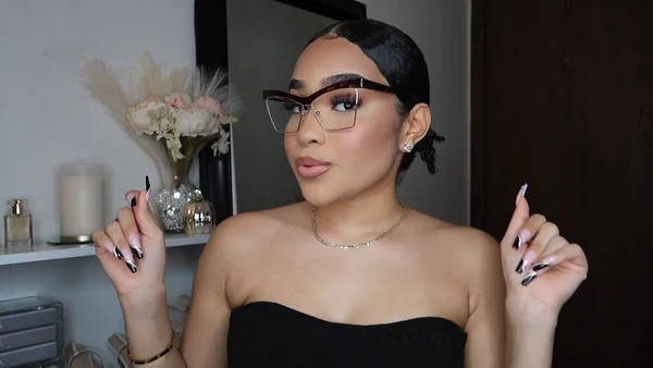 Symphony Taylor wearing Lensmart Madison chic cat - eye tortoiseshell glasses, featuring gold accents, cloud - like comfort nose pads, and a shape that flatters various face shapes.