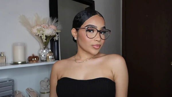 Symphony Taylor wearing Lensmart Molly cat - eye tortoiseshell glasses, showcasing their pointed - round shape, signature accents, retro vibes, and springy hinges.