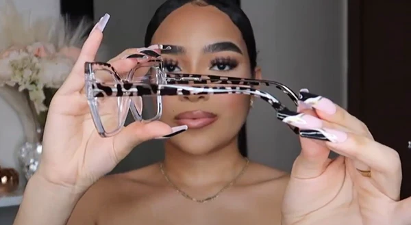 Symphony Taylor showcasing Lensmart Marley clear animal print eyeglasses, highlighting their subtle statement, wild touch, springy hinges, and ultimate versatility.