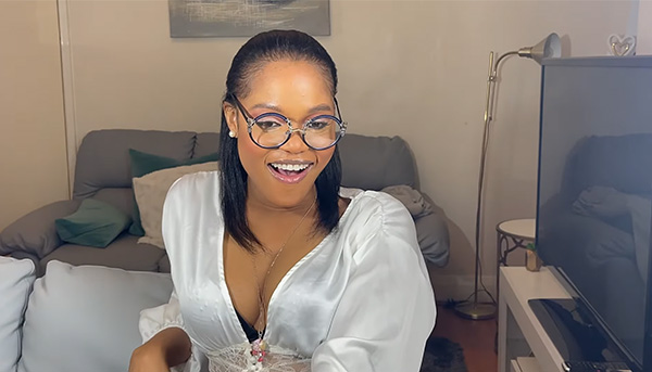 Wanita dons Lensmart Milani navy - blue glasses with floral side details, giving “old school, old money vibes”.