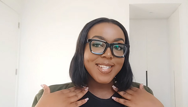 Namolinah dons Lensmart Kimberley glasses, featuring minimalist black frames & a matching chain for daily versatility.